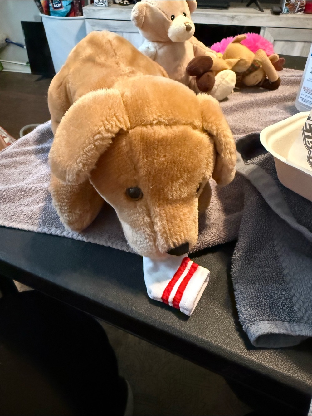 Vintage Tugger the playful pup Plush Dog Toy with Red-Striped Sock - Brown